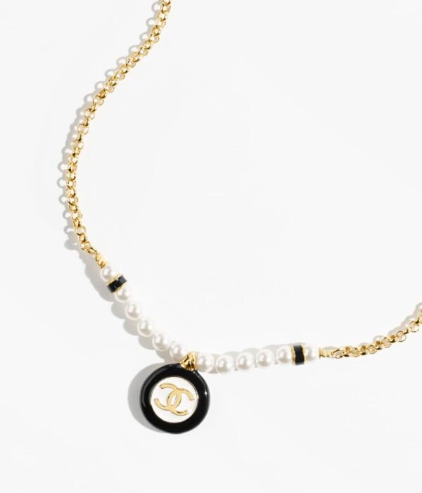 12460209-26BA-D5F5-F2A7-6BCC5CA62197.jpg Black and white medallion double C necklace