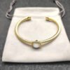 1CA58DEF-1889-316E-219B-5F3EA9CADC21.jpg Cable Classics Bracelet with White Agate and Diamonds 18K Yellow Gold 4mm
