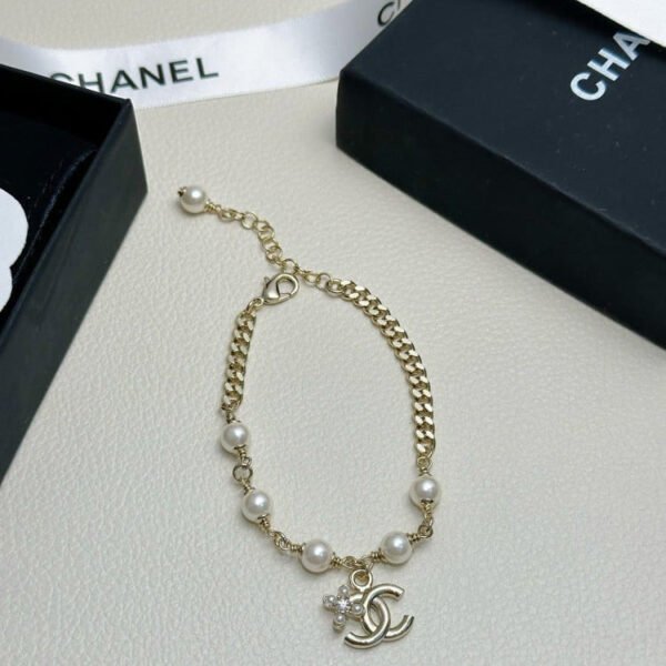 Double row pearls and diamonds double C bracelet