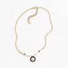 7390EB5E-663E-07E0-336E-9BD4C824AB61.jpg Black and white medallion double C necklace