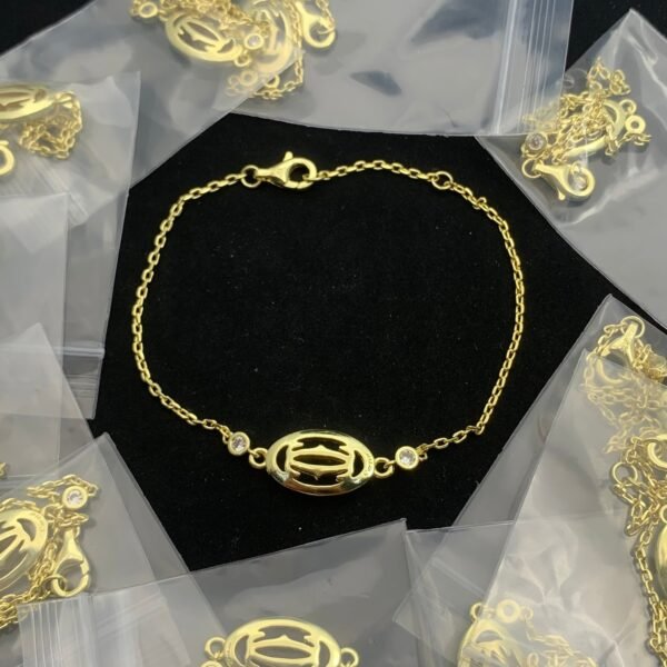 DOUBLE C DE CARTIER LOGO BRACELET - 18CT GOLD